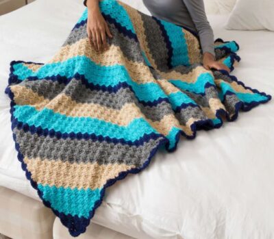 A photo of a corner to corner knit blanket - an available free handcrafted item from Community Threads