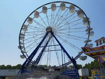 photo of a ferris wheel representing the Fredericksburg Agricultural Fair - a tabled event attended by Community Threads