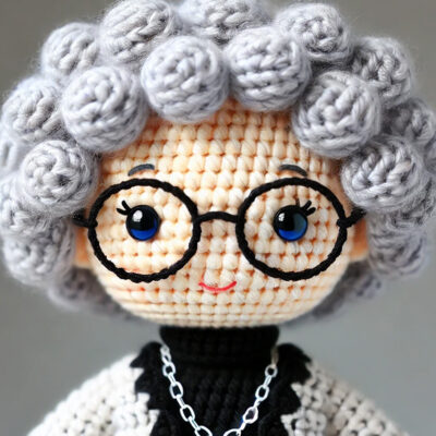 Crochet doll version of Doris, member of the Board of Directors for Community Threads.