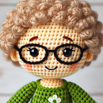 Crochet doll version of Pam Greswolde, President of the Board of Directors for Community Threads.