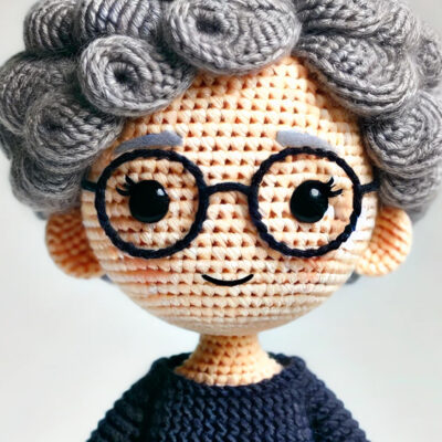 Crochet doll version of Marcia Reed, King George Coordinator of Community Threads.